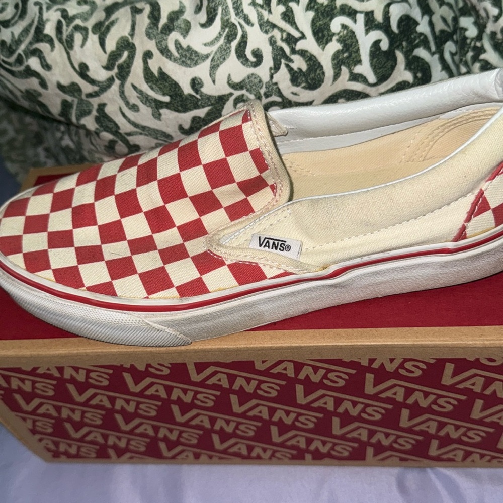 Red and white checkerboard slip on vans